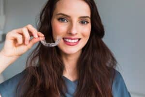 Woman with white, perfectly aligned smile after clear aligner treatment in Salem, OR