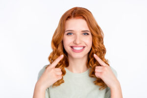 Woman with bright smile after clear aligner treatment in Salem, OR